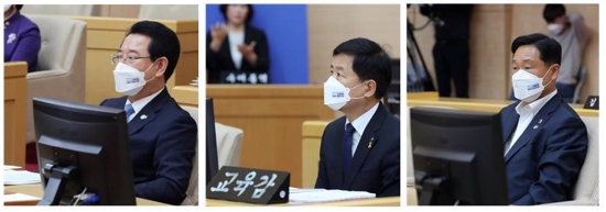 왼쪽부터 김영록 도지사, 장석웅 교육감, 강문성 도의원이 「COP28 남해안 남중권 유치」 문구가 새겨진 마스크를 쓰고 도정질문에 임하고 있다/사진=전남도의회