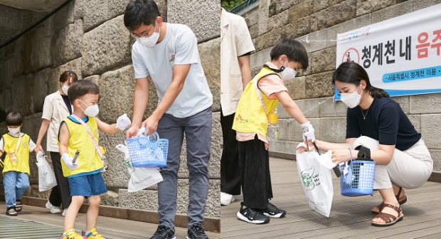 지난 20일, SK행복어린이집 종달새/파랑새반(3~4세 원아반) 원아와 학부모들이 청계천 일대에서 쓰레기를 주우며 산해진미 캠페인 활동에 참여하고 있다.