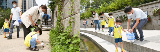 지난 20일, SK행복어린이집 종달새/파랑새반(3~4세 원아반) 원아와 학부모들이 청계천 일대에서 쓰레기를 주우며 산해진미 캠페인 활동에 참여하고 있다.