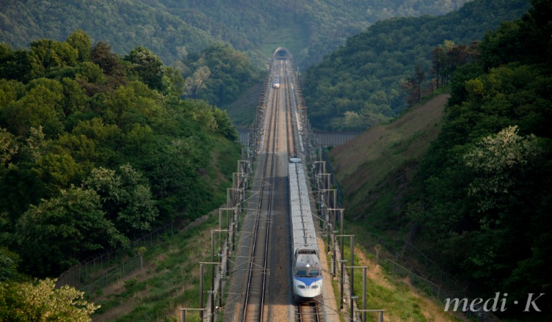 South Korea's mountainous terrain makes train travel a delight, with the scenery unfolding beyond the window like a private show. Mountains, rivers, and fields shift hues with the seasons, turning the ride itself into a quiet meditation on the land. (Image courtesy of Clipart Korea)